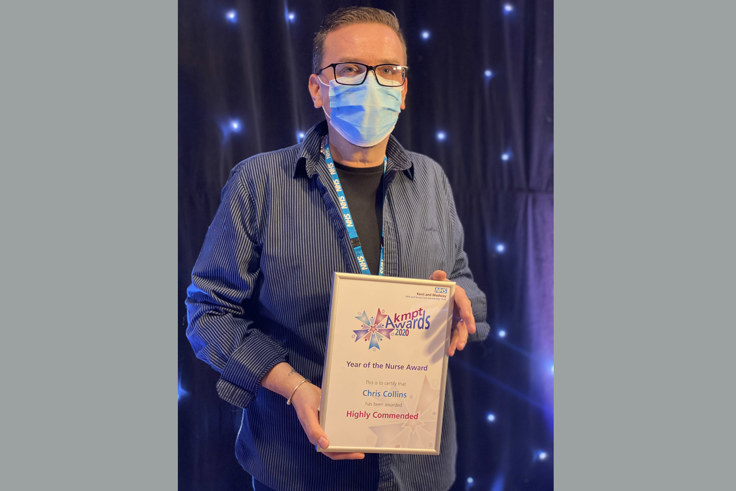 Chris Collins with certificate