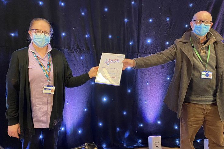 Members of the patient Flow team with award
