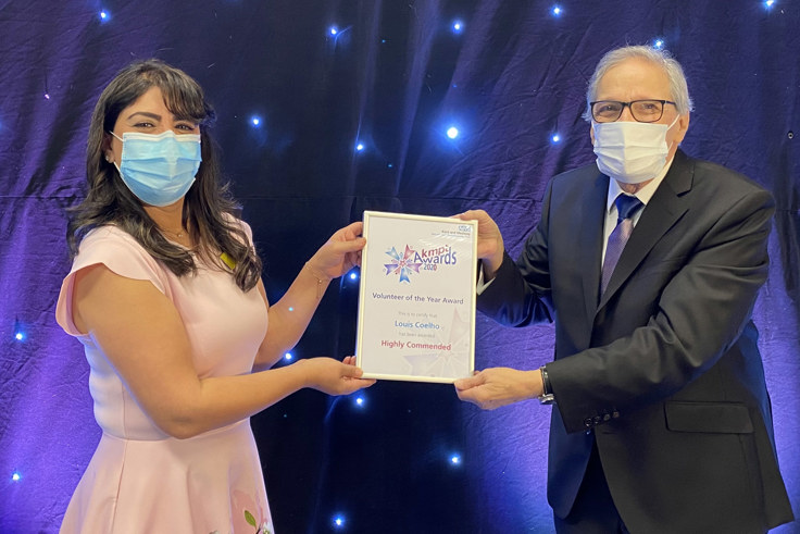 Louis Coelle and Afifa Qazi. Louis holds his certificate