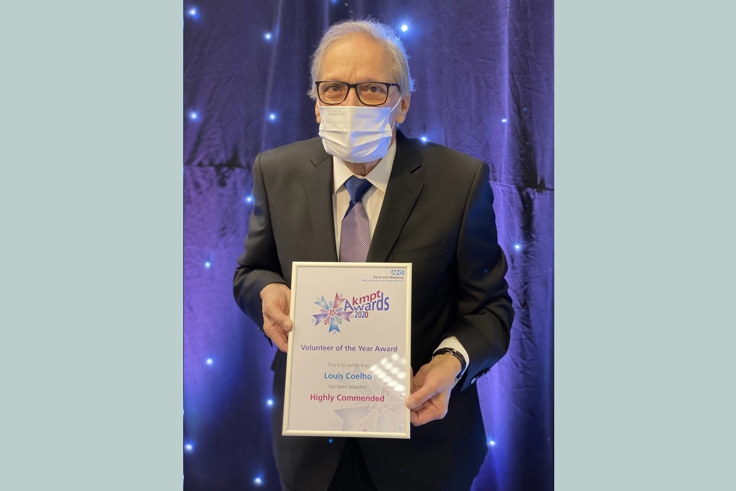 Louis Coello with Volunteer of the year certificate