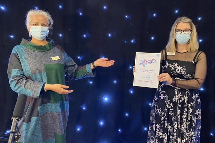 Jacquie and Venu with award