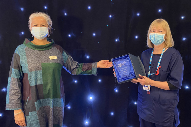 Kim Terry and Venu Branch with award