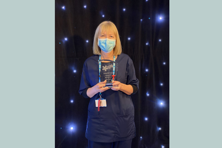 Kim Terry with award
