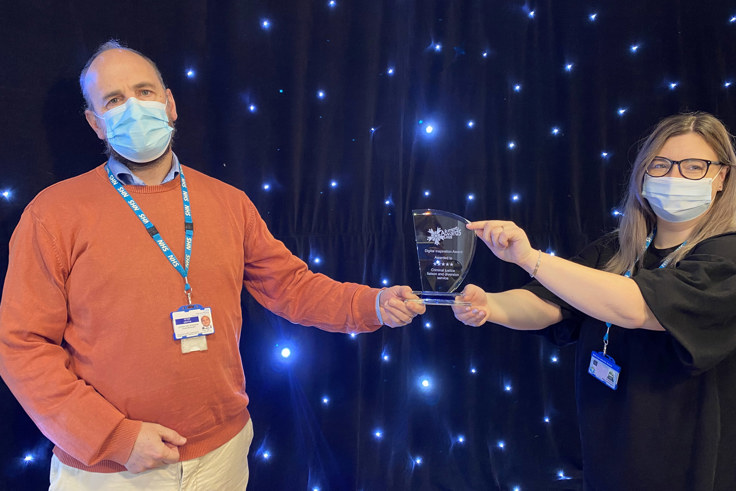 Peter Griffin and Rebecca Elkington with award