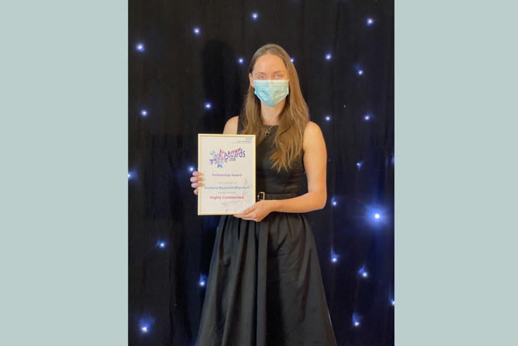 Victoria Nystrom-Marshall with her award