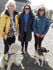 Sue and her PAT dog with members of the volunteer services team