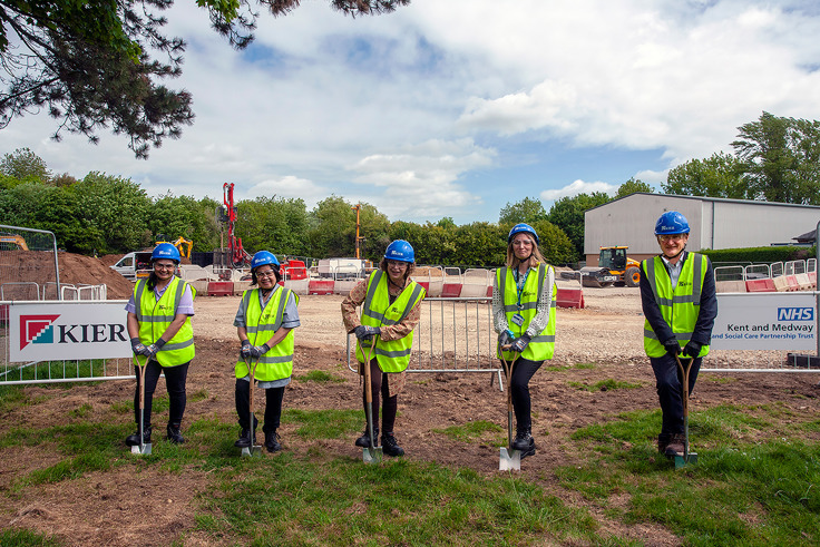 Members of KMPT staff at Ruby Ward site with spades and high vis